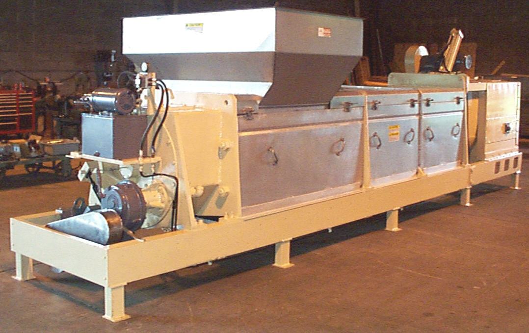 Continuous SCREW PRESS for waste stream compaction and dewatering.
